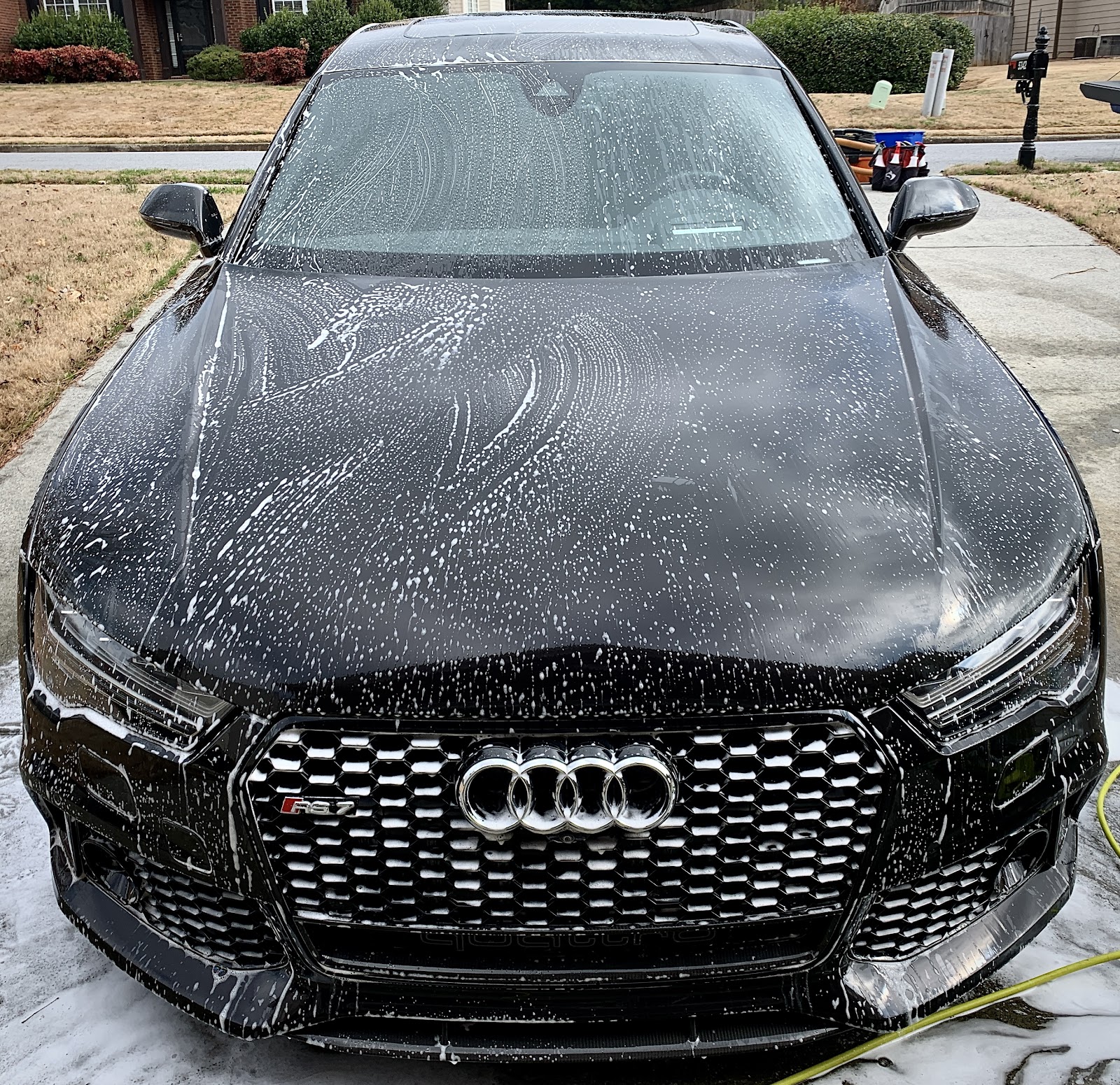 Sumptuous Mobile Detailing — black Audi RS mid-foam wash with hand-applied suds covering hood and windshield